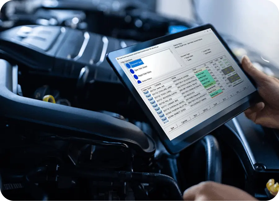 An interface of an automotive dealership management software showing inventory and sales data on a tablet.
