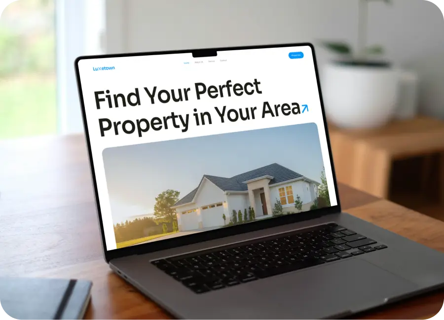 A custom-designed real estate website showcased on multiple devices, highlighting its responsive design.