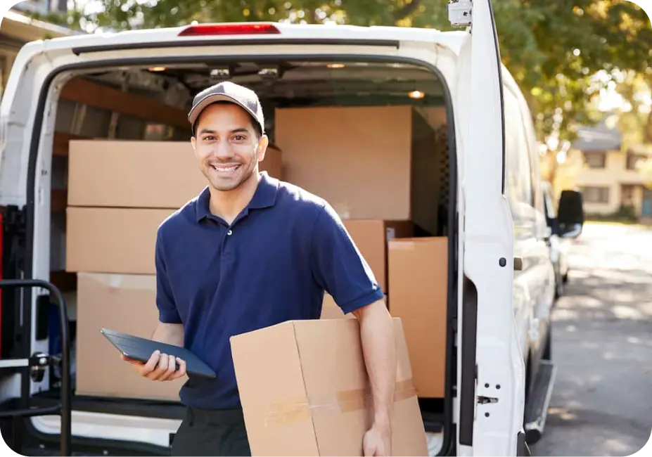 A mechanic using a workshop management software on a rugged tablet to manage repairs and inventory.