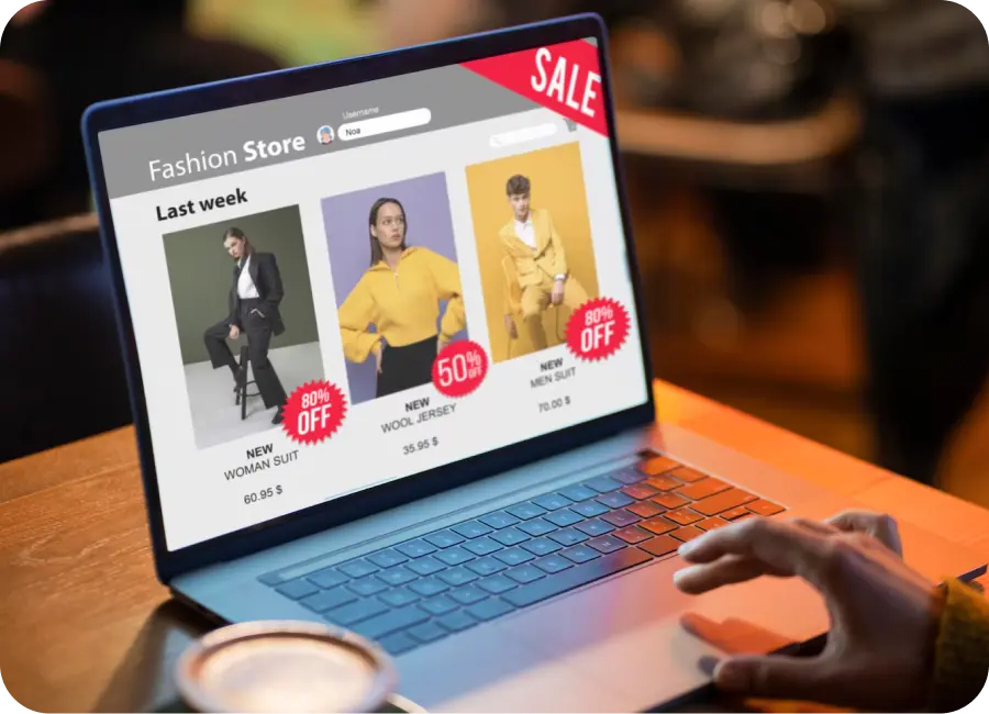 An eCommerce website for a retail brand displayed on a laptop and mobile phone.