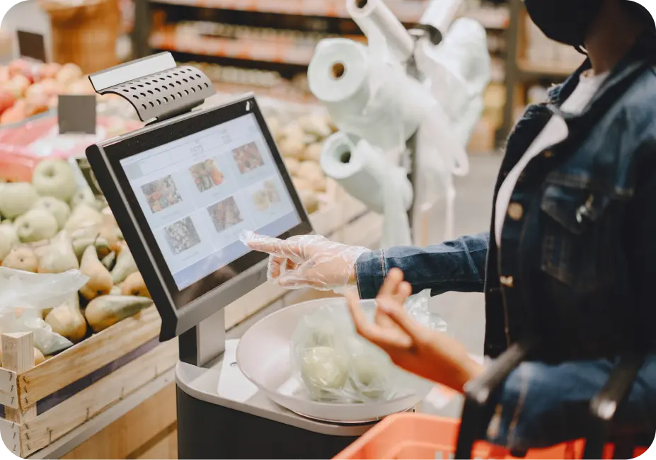 A mechanic using a workshop management software on a rugged tablet to manage repairs and inventory.